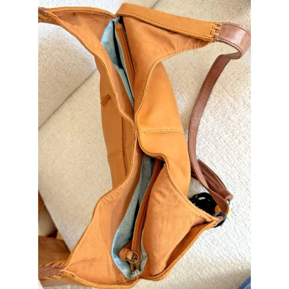 The Sak Women's Huntley‎ Leather Hobo Bag Metro Sling Pebbled Tan with Tassel